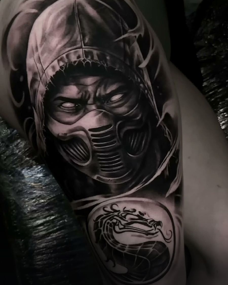 Healed black and grey character portrait shoulder tattoo