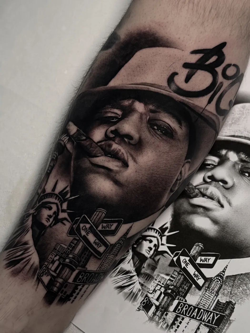 Black and grey hip-hop legend portrait tattoo